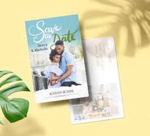front of and back of postcards on table