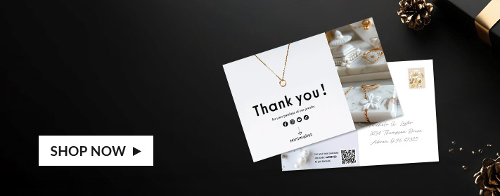 front of and back of postcards on table